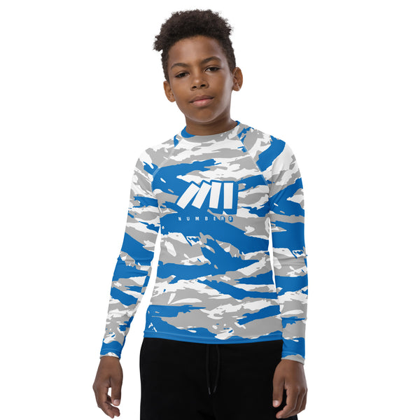 Athletic sports compression shirt for youth football, basketball, baseball, golf, softball etc similar to Nike, Under Armour, Adidas, Sleefs, printed with camouflageblue, white, and gray colors Detroit Lions. 