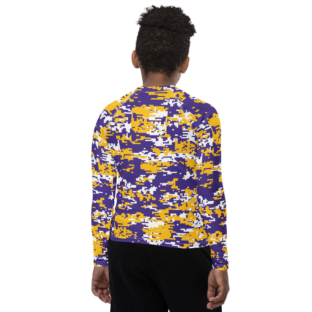 Athletic sports compression shirt for youth football, basketball, baseball, golf, softball etc similar to Nike, Under Armour, Adidas, Sleefs, printed with camouflage purple, yellow, and white colors.     