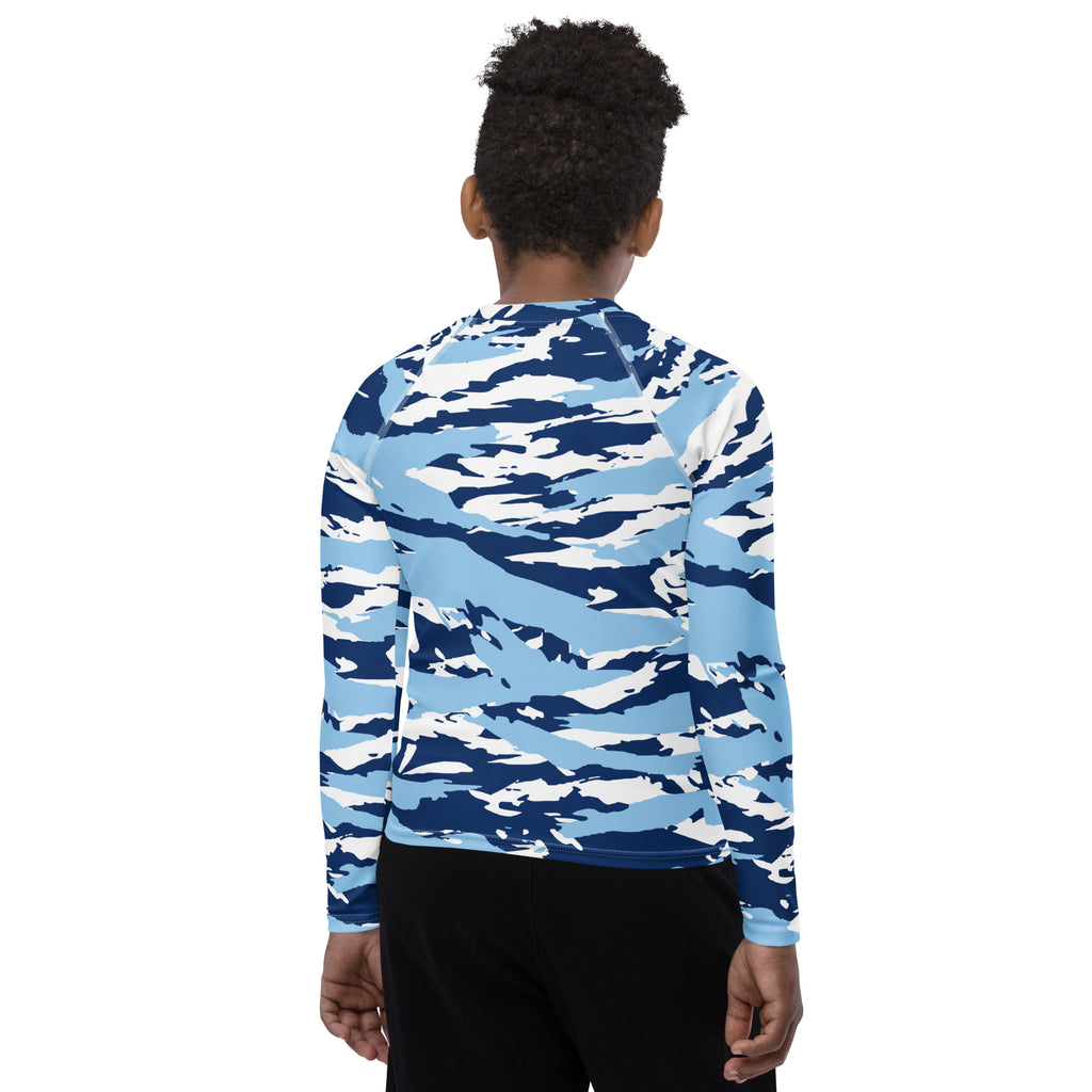 Athletic sports compression shirt for youth football, basketball, baseball, golf, softball etc similar to Nike, Under Armour, Adidas, Sleefs, printed with camouflage baby blue, white, and blue colors.   