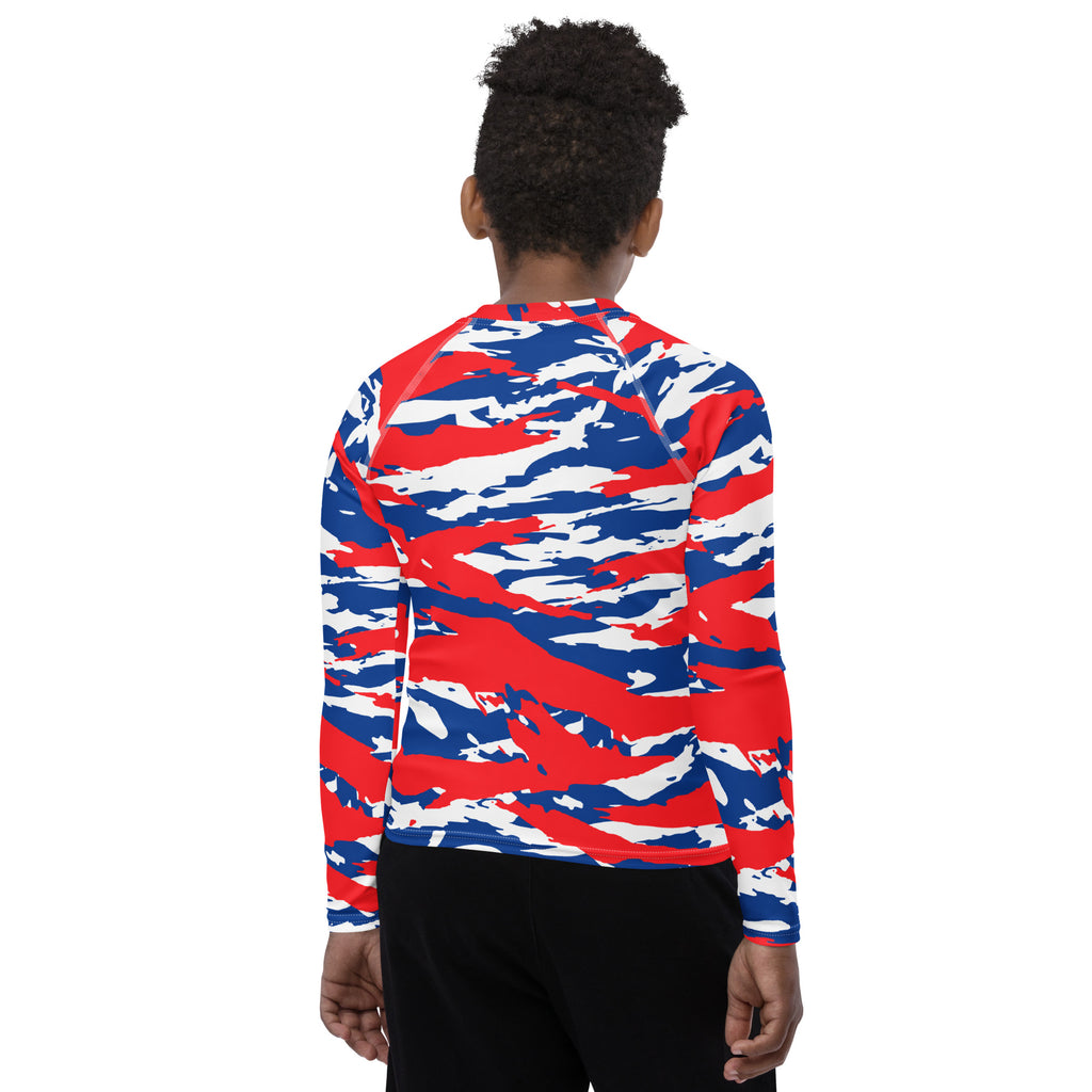 Athletic sports compression shirt for youth football, basketball, baseball, golf, softball etc similar to Nike, Under Armour, Adidas, Sleefs, printed with camouflage red, white, and blue colors Los Angeles Clippers. 