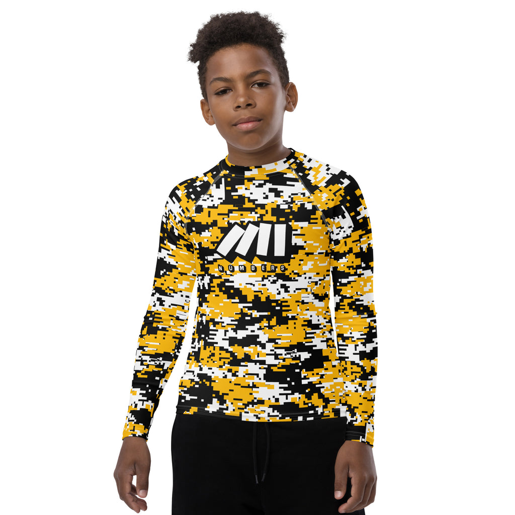 Athletic sports compression shirt for youth football, basketball, baseball, golf, softball etc similar to Nike, Under Armour, Adidas, Sleefs, printed with camouflage yellow, black, and white colors.      