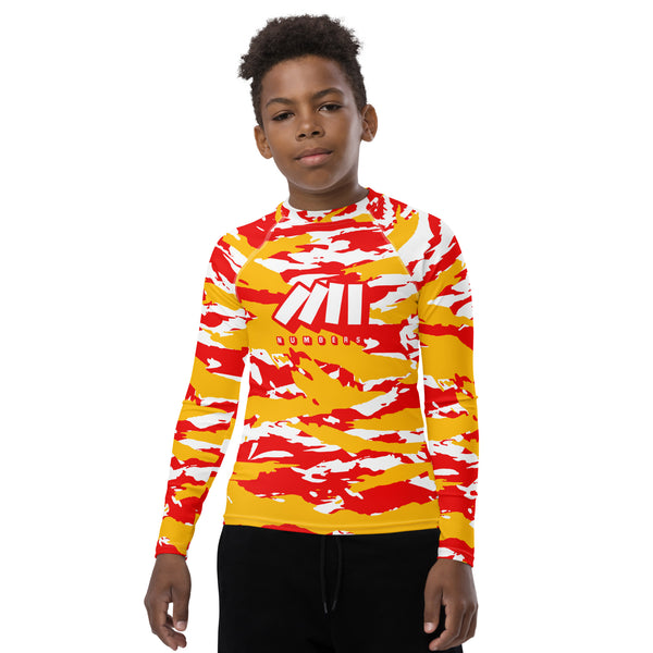 Athletic sports compression shirt for youth football, basketball, baseball, golf, softball etc similar to Nike, Under Armour, Adidas, Sleefs, printed with camouflagered, yellow, and white colors Kansas City Chiefs. 