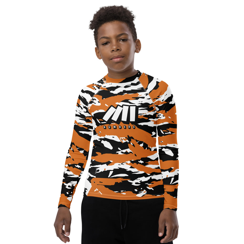 Athletic sports compression shirt for youth football, basketball, baseball, golf, softball etc similar to Nike, Under Armour, Adidas, Sleefs, printed with camouflage colors.   