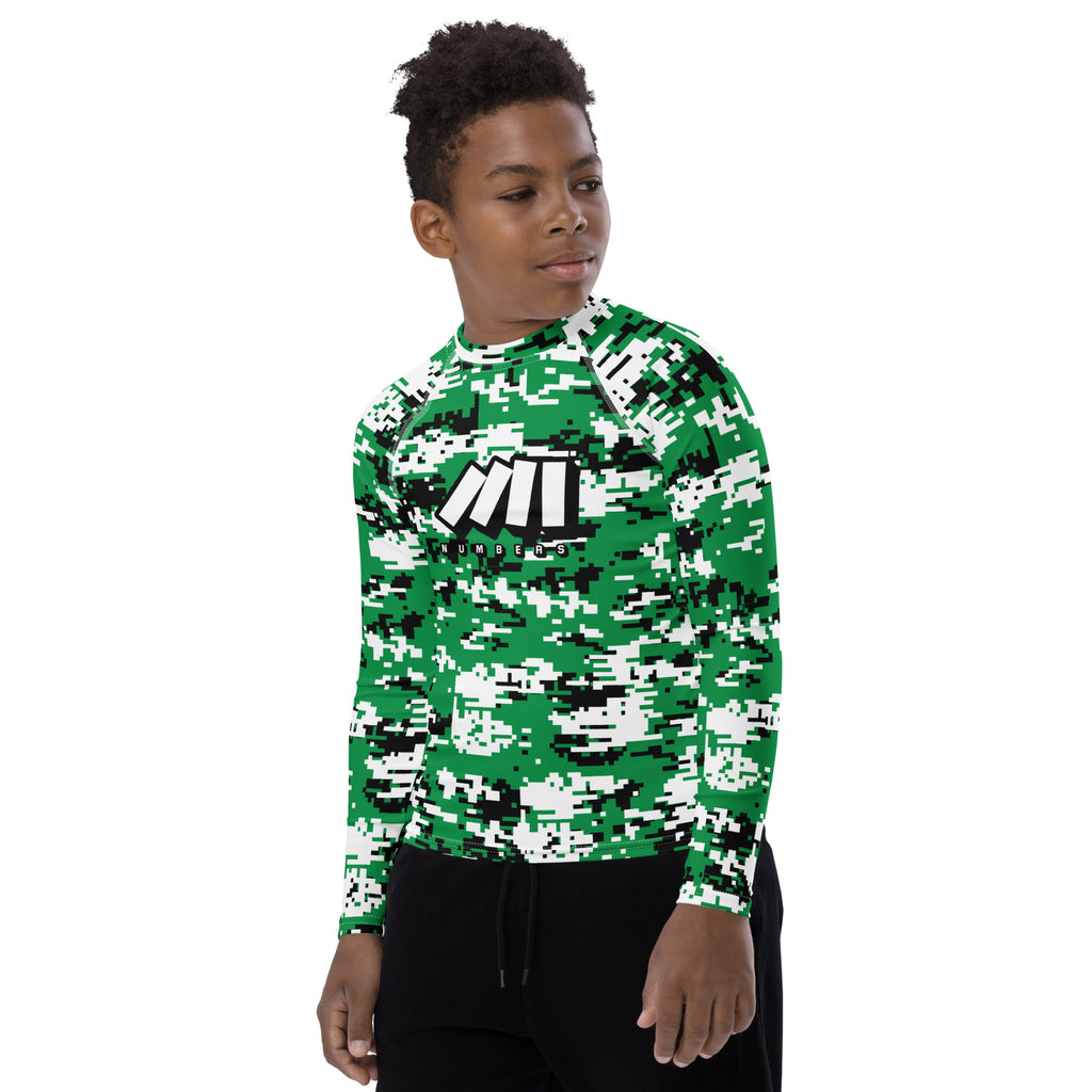 Athletic sports compression shirt for youth football, basketball, baseball, golf, softball etc similar to Nike, Under Armour, Adidas, Sleefs, printed with camouflage green, white, and black colors.     