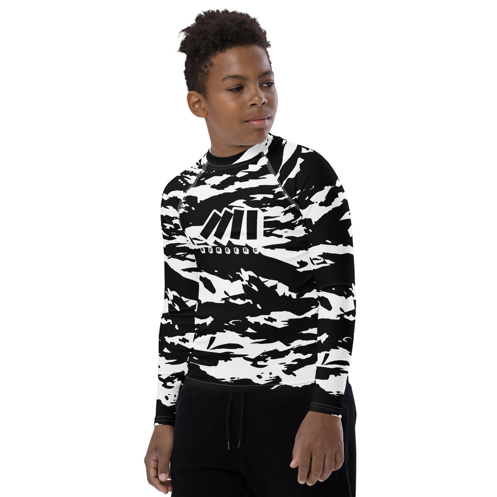 Athletic sports compression shirt for youth football, basketball, baseball, golf, softball etc similar to Nike, Under Armour, Adidas, Sleefs, printed with camouflage black and white colors.    