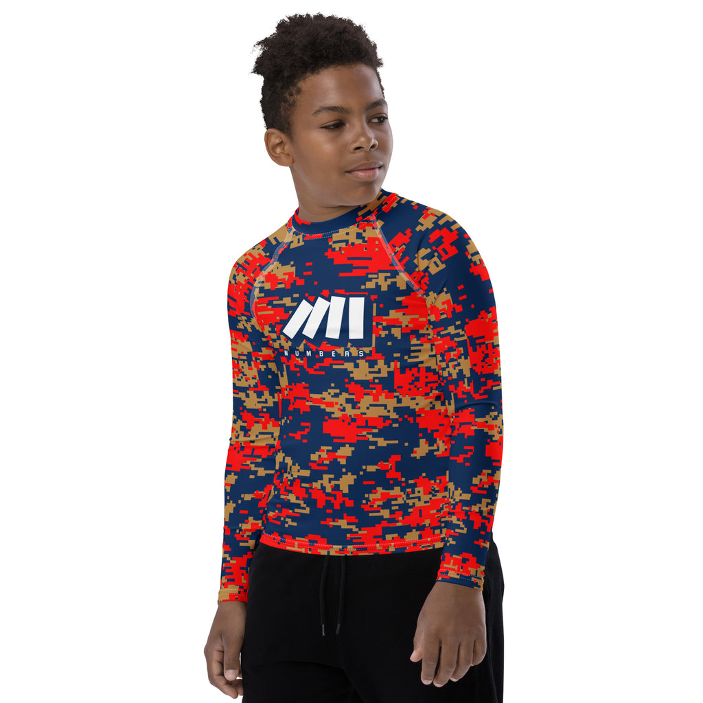 Athletic sports compression shirt for youth football, basketball, baseball, golf, softball etc similar to Nike, Under Armour, Adidas, Sleefs, printed with camouflage navy blue, gold, and red colors.  