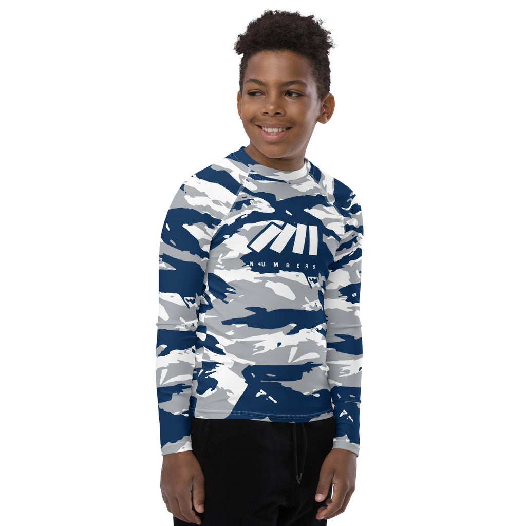Athletic sports compression shirt for youth football, basketball, baseball, golf, softball etc similar to Nike, Under Armour, Adidas, Sleefs, printed with camouflage navy blue, white, and gray colors.      
