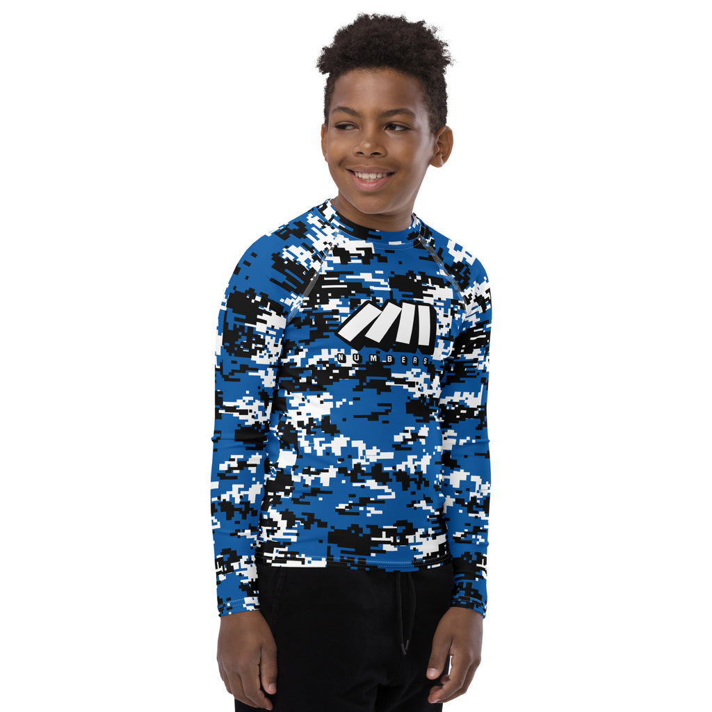 Athletic sports compression shirt for youth football, basketball, baseball, golf, softball etc similar to Nike, Under Armour, Adidas, Sleefs, printed with camouflage baby blue, white, and blue colors Orlando Magic.   