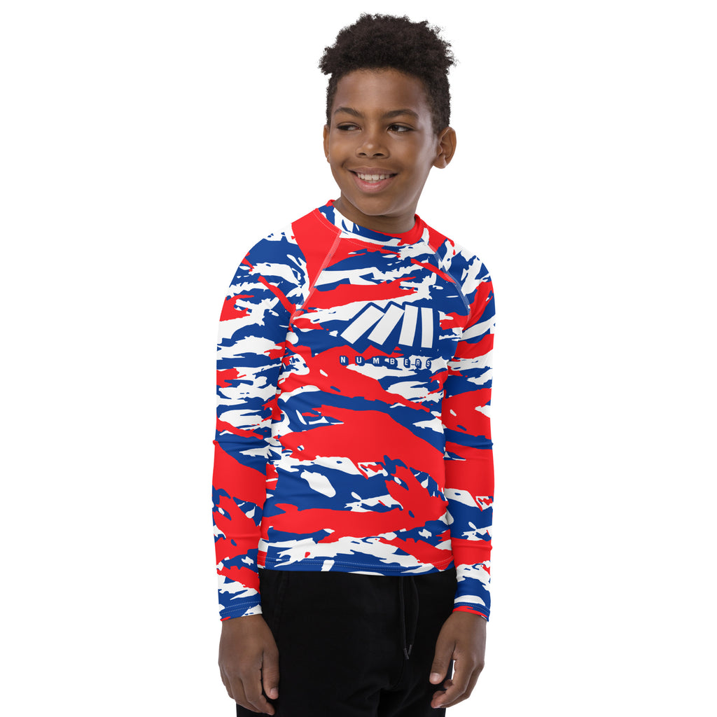 Athletic sports compression shirt for youth football, basketball, baseball, golf, softball etc similar to Nike, Under Armour, Adidas, Sleefs, printed with camouflage red, white, and blue colors Los Angeles Clippers.  