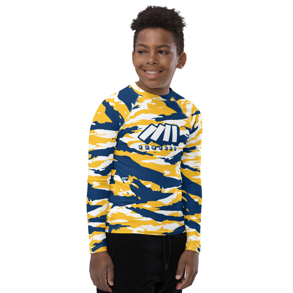 Athletic sports compression shirt for youth football, basketball, baseball, golf, softball etc similar to Nike, Under Armour, Adidas, Sleefs, printed with camouflage navy blue, yellow, and white colors.    