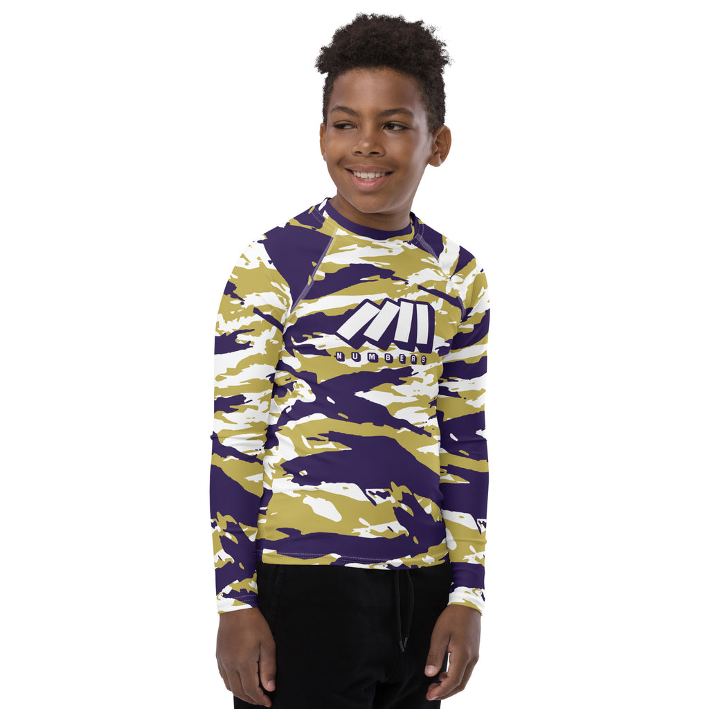 Athletic sports compression shirt for youth football, basketball, baseball, golf, softball etc similar to Nike, Under Armour, Adidas, Sleefs, printed with camouflage purple, gold, and white colors Washington Huskies.    