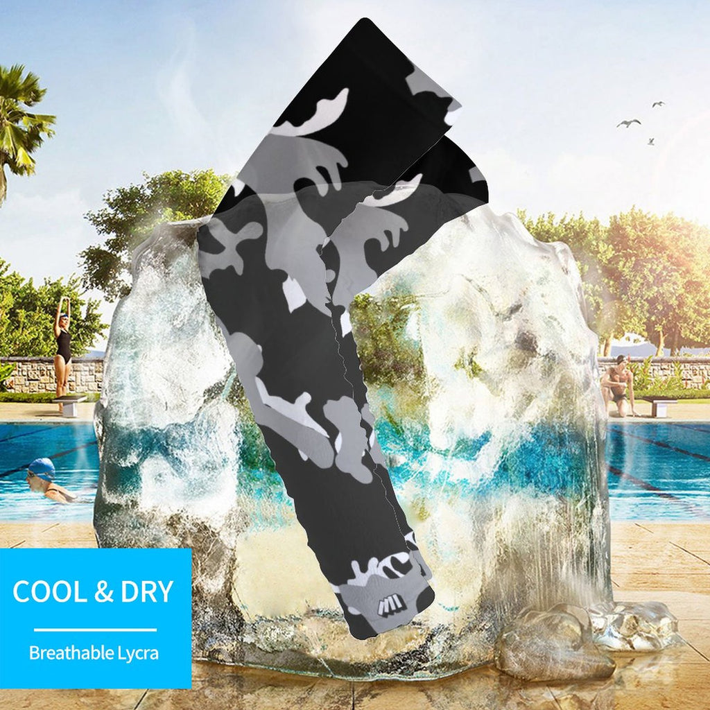 Athletic sports compression arm sleeve for youth and adult football, basketball, baseball, and softball printed with camo black, gray, and white colors.
