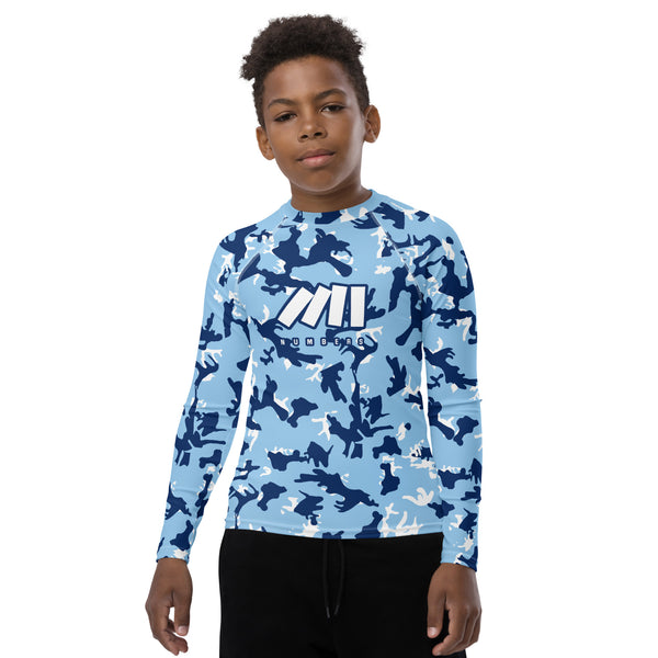 Athletic sports compression shirt for youth football, basketball, baseball, golf, softball etc similar to Nike, Under Armour, Adidas, Sleefs, printed with camouflage powder blue, white, blue and white UNC Tar Heels colors
