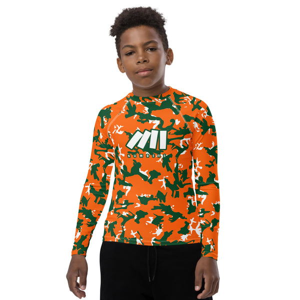 Athletic sports compression shirt for youth football, basketball, baseball, golf, softball etc similar to Nike, Under Armour, Adidas, Sleefs, printed with camouflage orange, green and white Miami Hurricanes colors