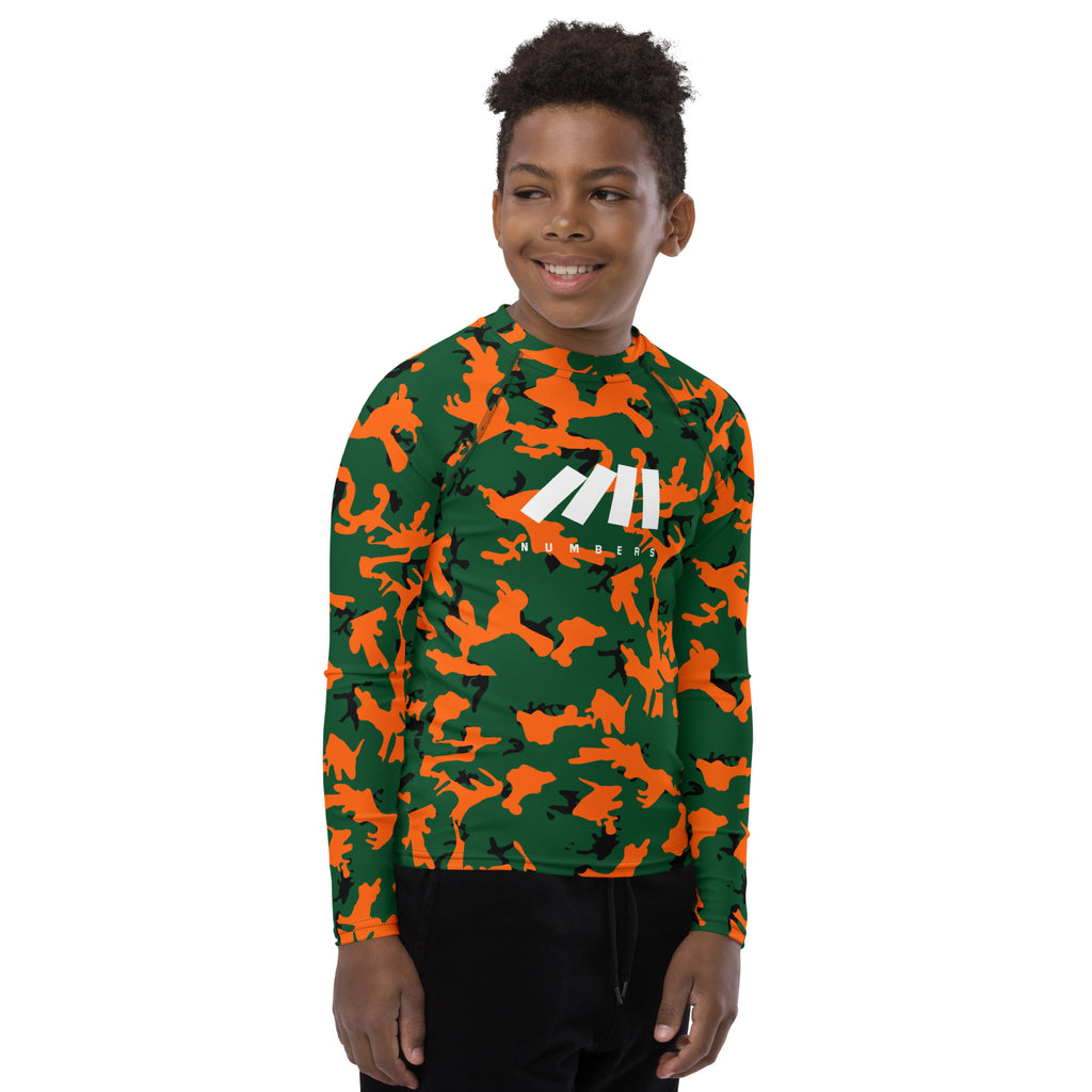 Athletic sports compression shirt for youth football, basketball, baseball, golf, softball etc similar to Nike, Under Armour, Adidas, Sleefs, printed with camouflage orange, green and black Miami Hurricanes colors