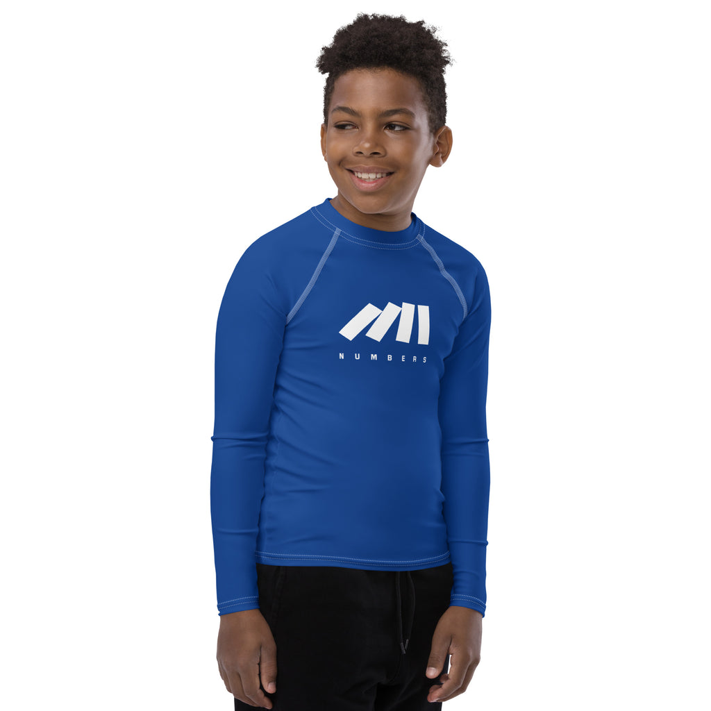 Athletic sports compression shirt for youth football, basketball, baseball, golf, softball etc similar to Nike, Under Armour, Adidas, Sleefs, printed in the color royal blue