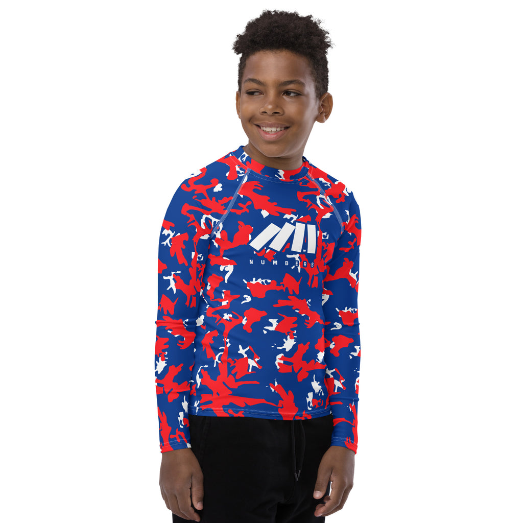 Athletic sports compression shirt for youth football, basketball, baseball, golf, softball etc similar to Nike, Under Armour, Adidas, Sleefs, printed with camouflage red, blue and white Philadelphia 76ers colors